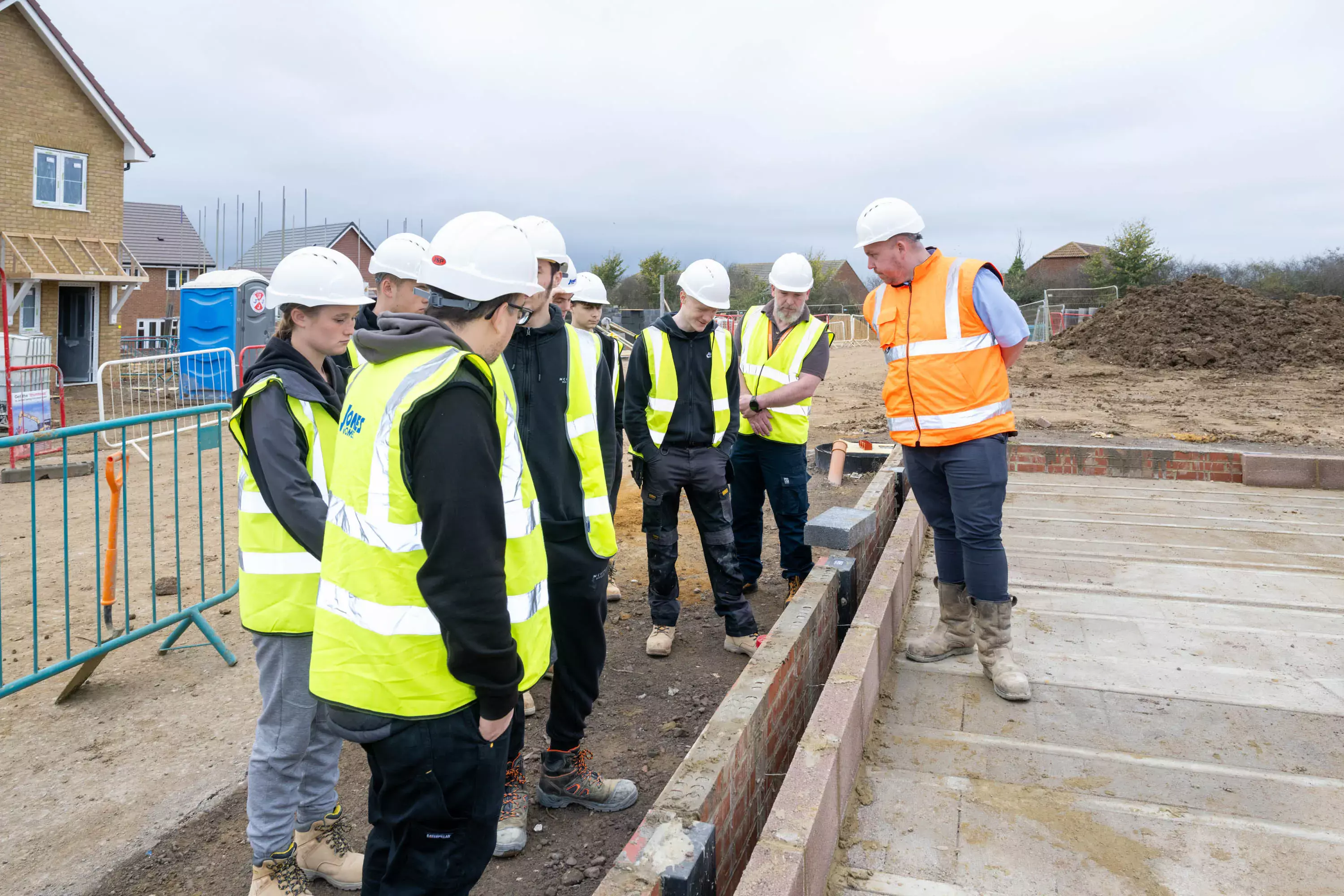 Bricklaying students get valuable insight into careers in construction on visit to new homes development in Minster